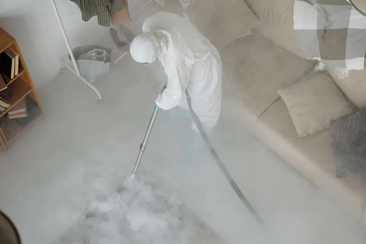 Biohazard cleanup technician in protective equipment, Japantown and Luna Park, San Jose, CA